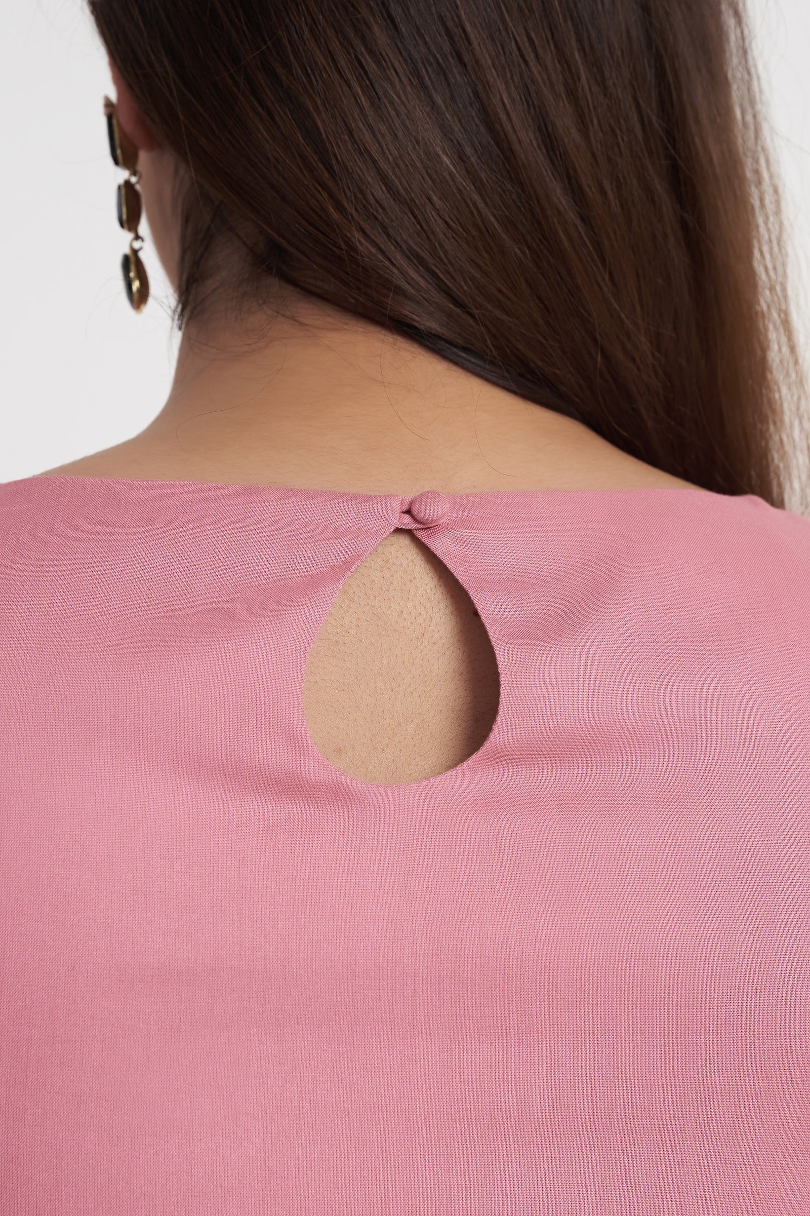Keyhole button back detail on dusty rose embroidered top