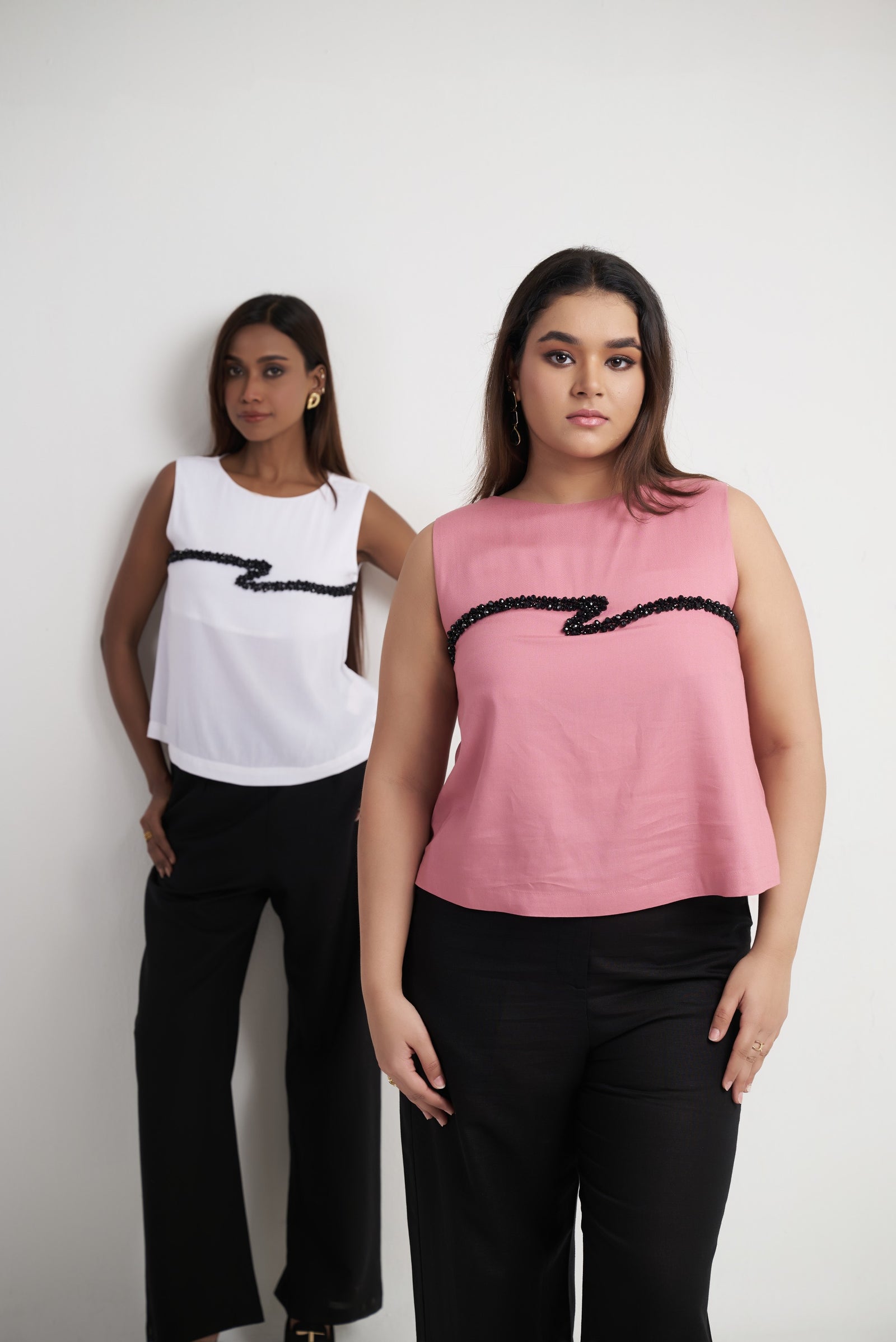 Beaded embroidered sleeveless top for women shown in bright white and dusty rose