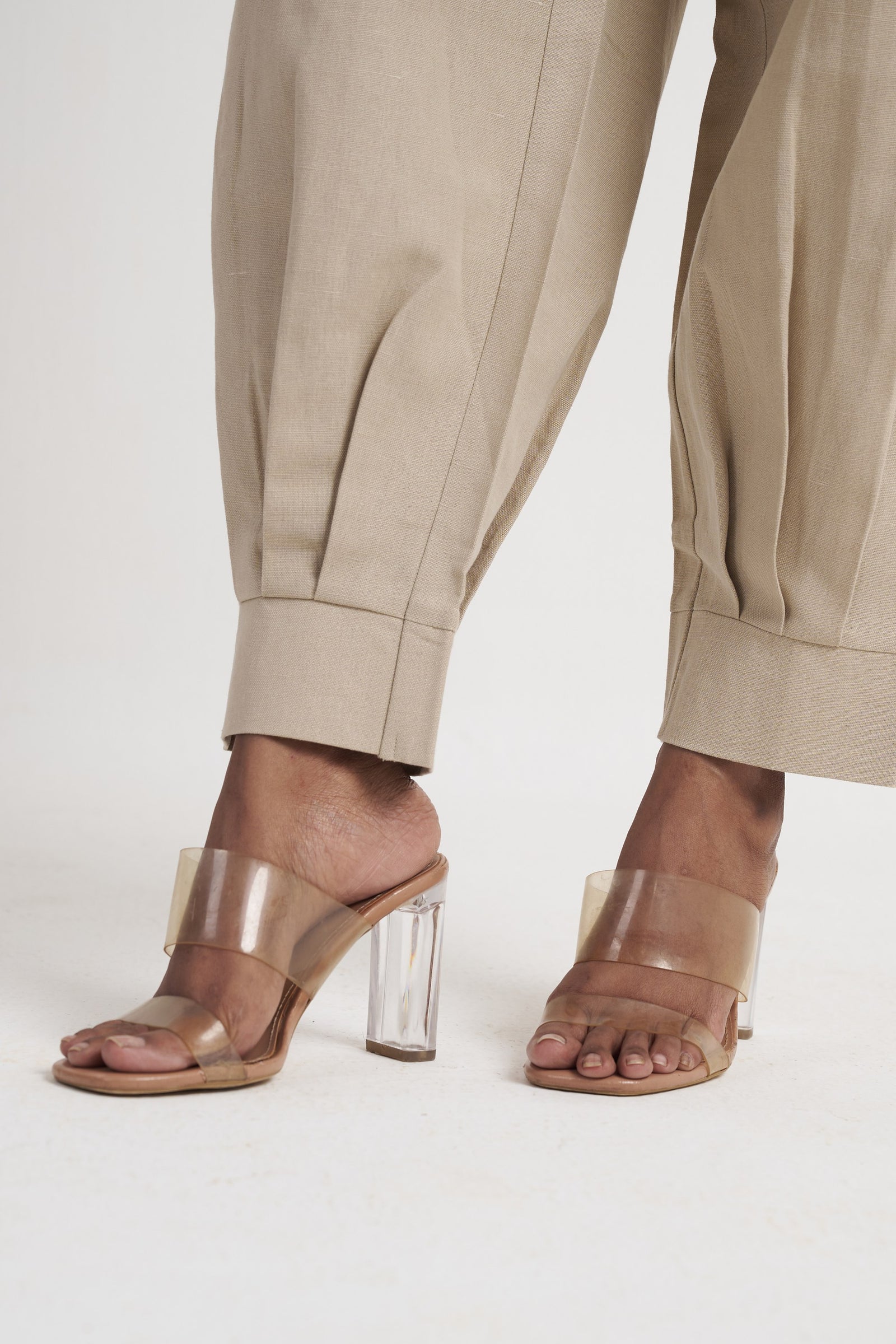 Zykaz High-Rise Pleated Tapered Trouser in White Onyx — turned-up cuff detail