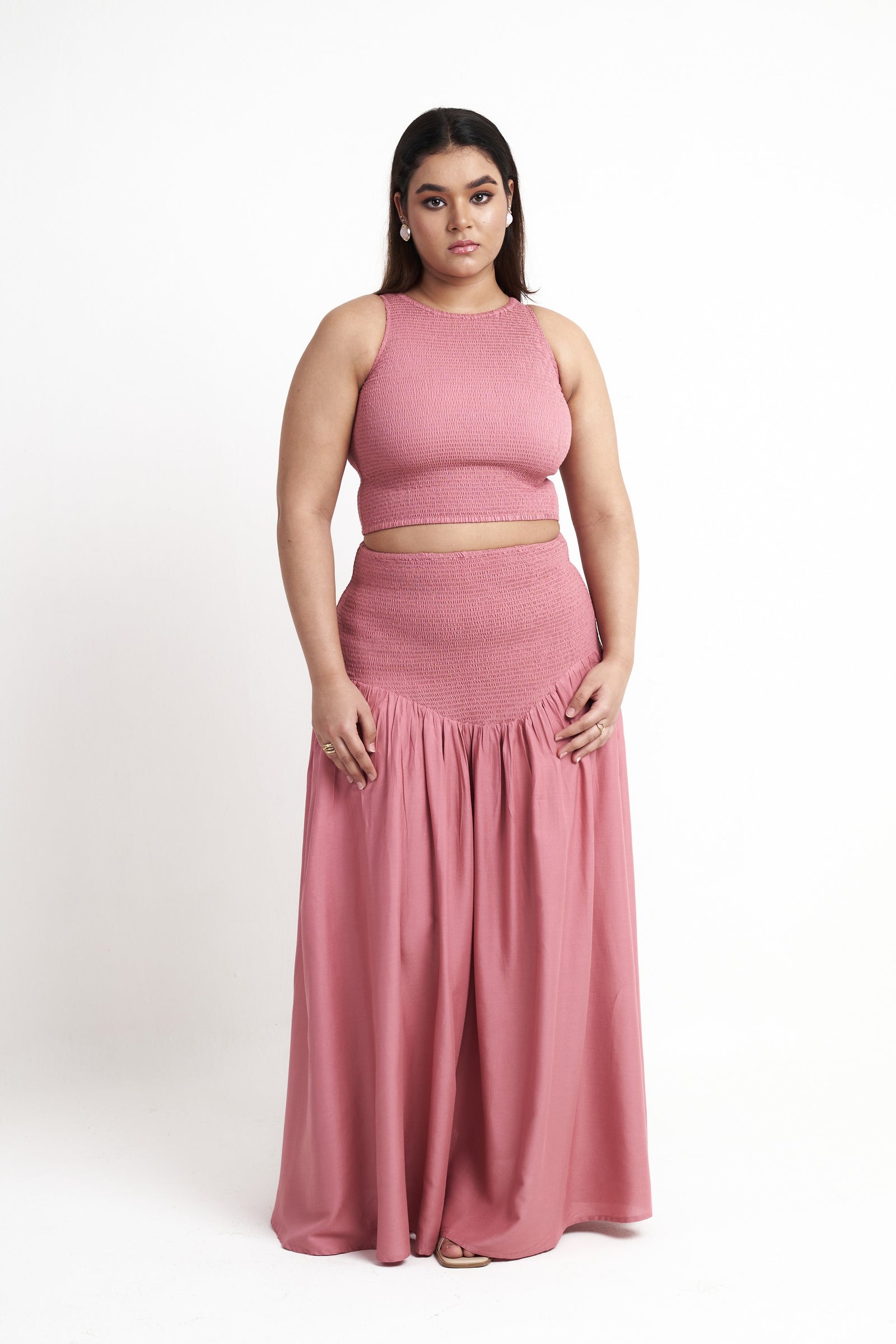 Smocked halter neck crop top for women in dusty rose styled with matching skirt